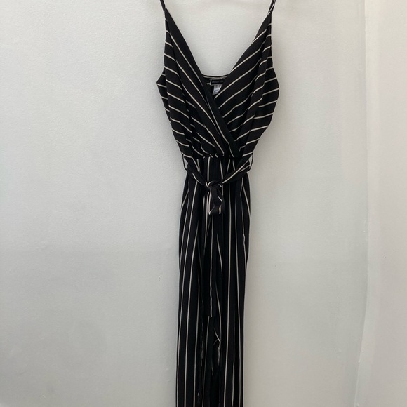 Pants - Black with white stripes jumpsuit with wide legs and belt.  Size medium